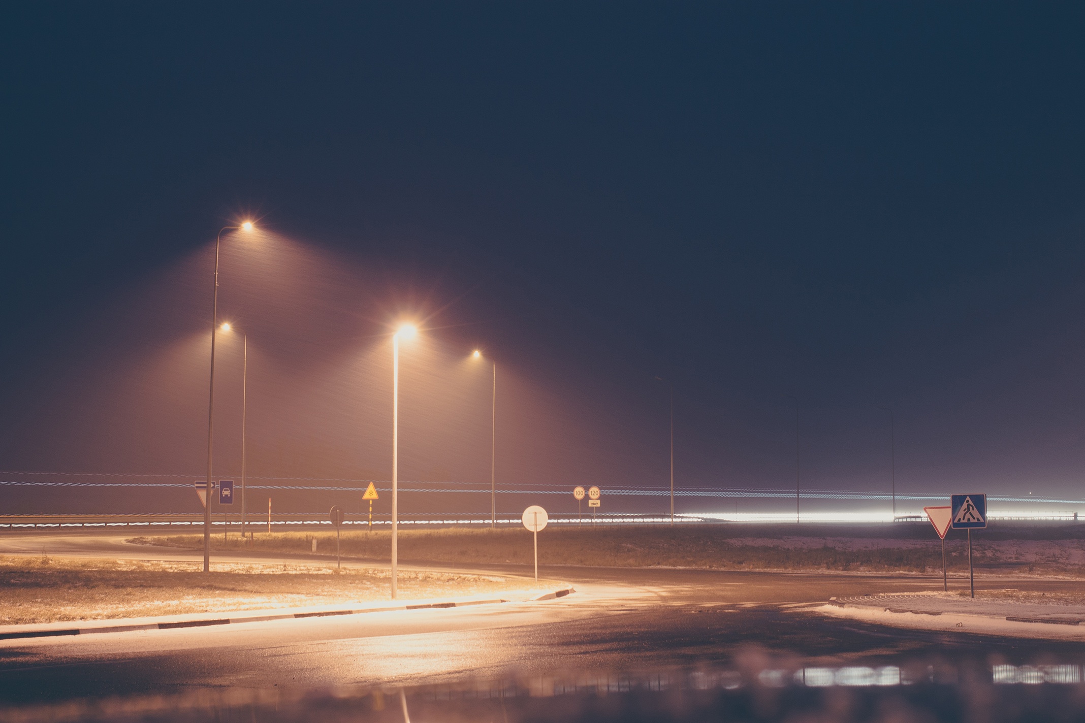 road lights, foggy evening in winter