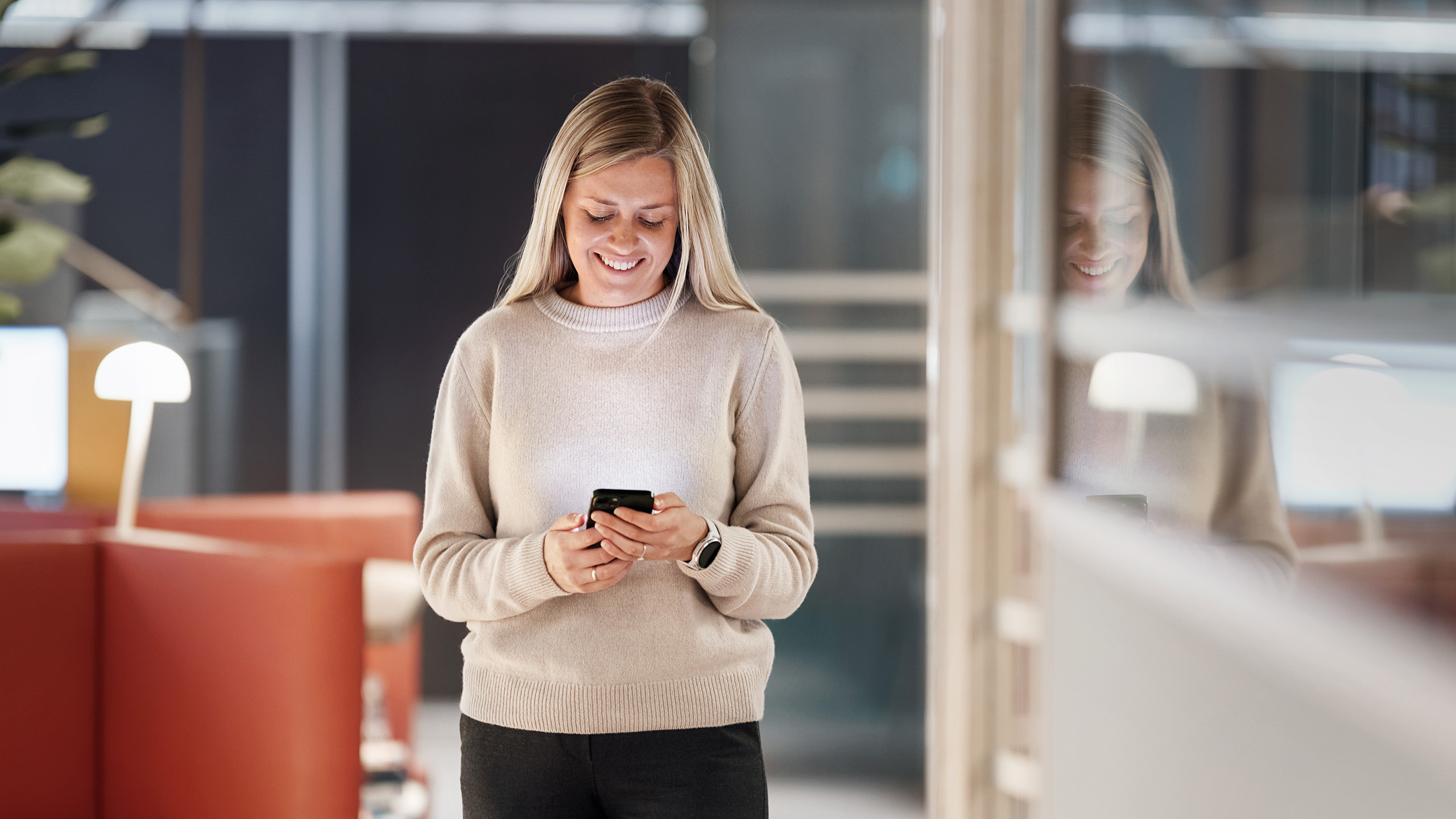 a woman holding a phone