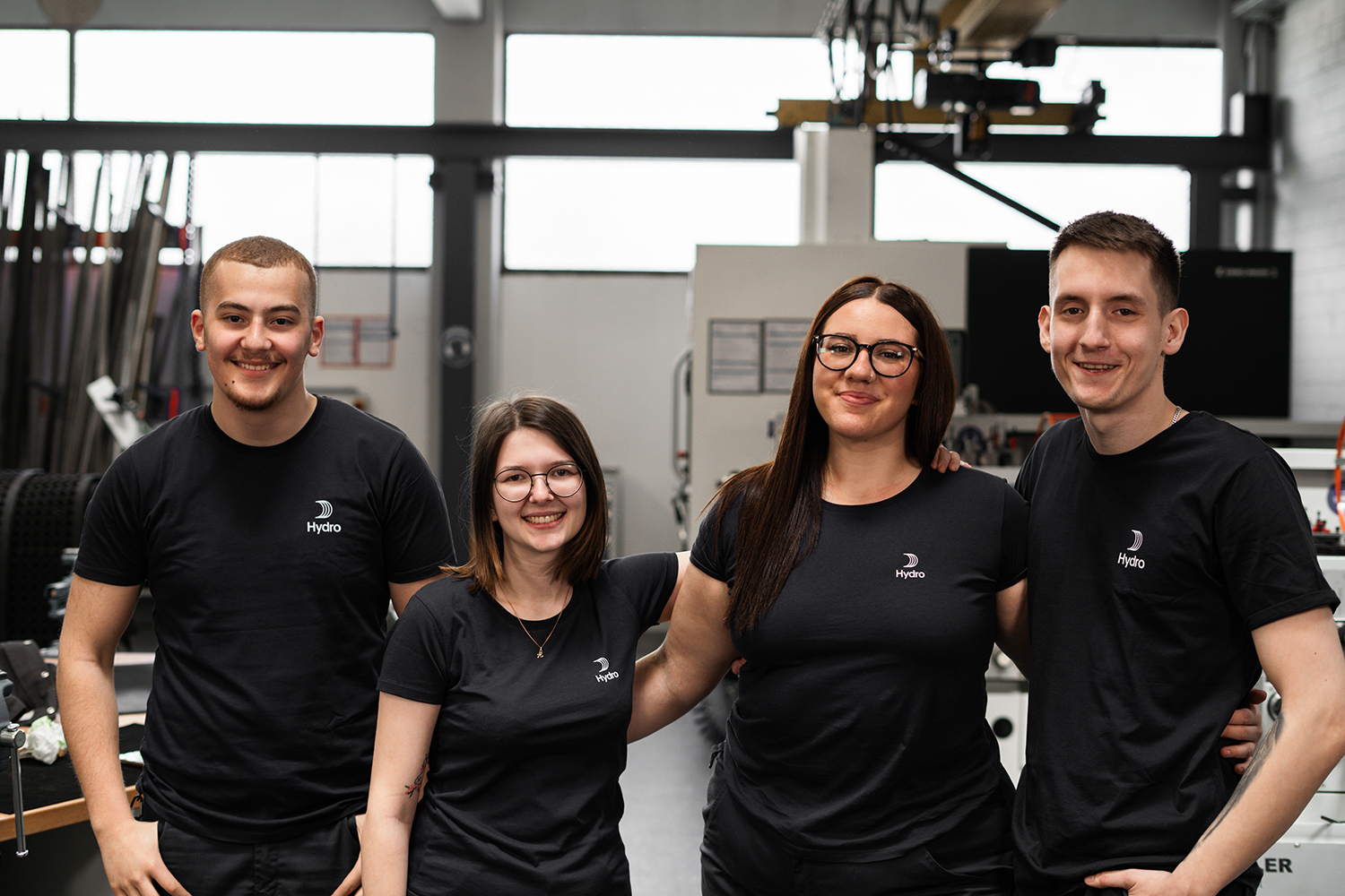 a group of people in black shirts