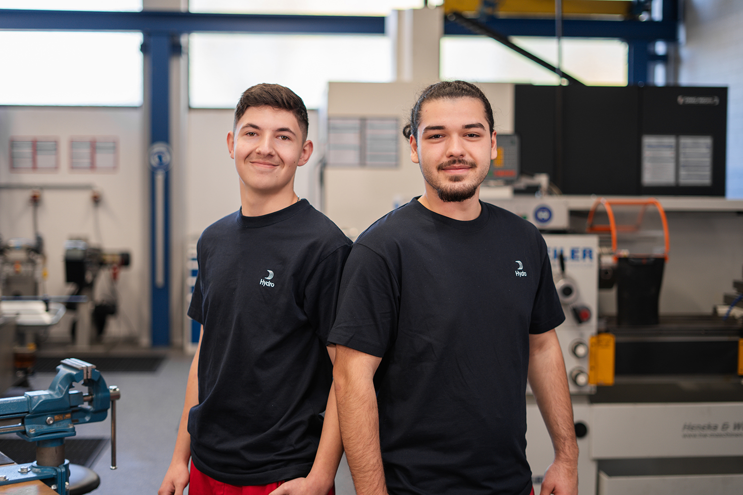 two men standing in a room