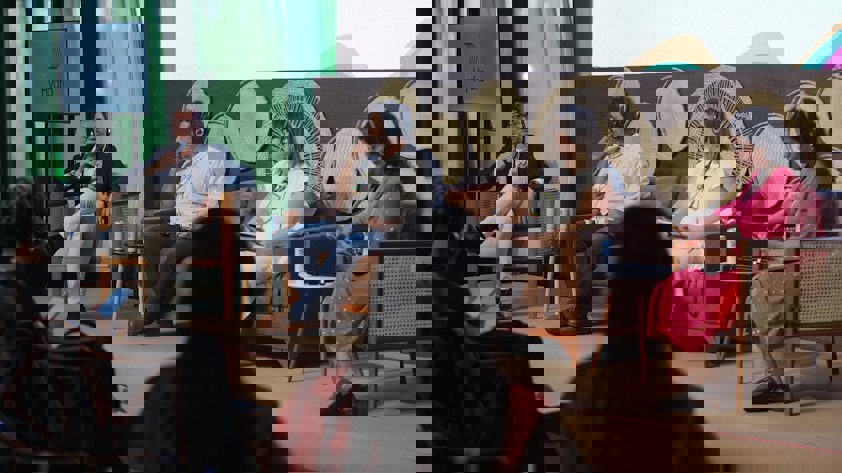 a group of people sitting in chairs