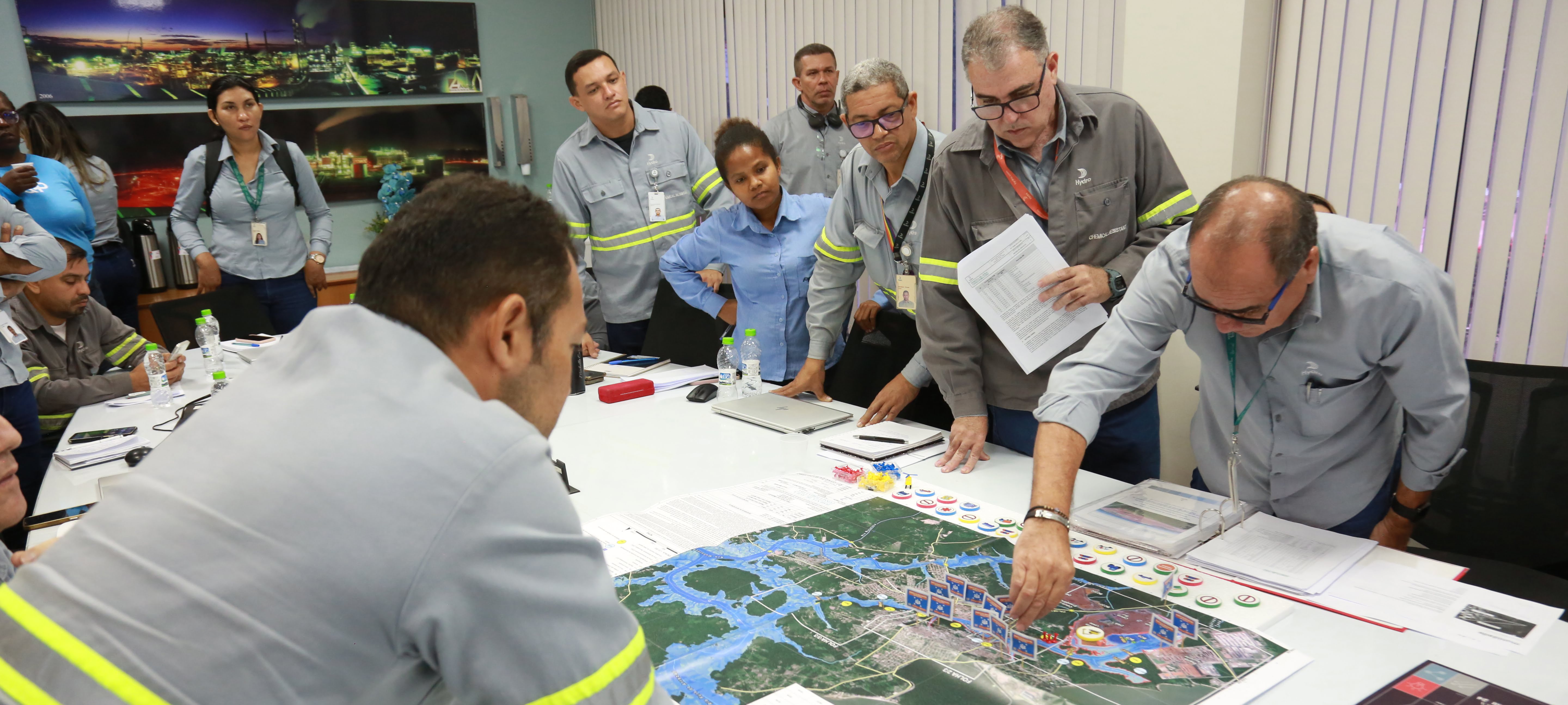a group of people looking at a map