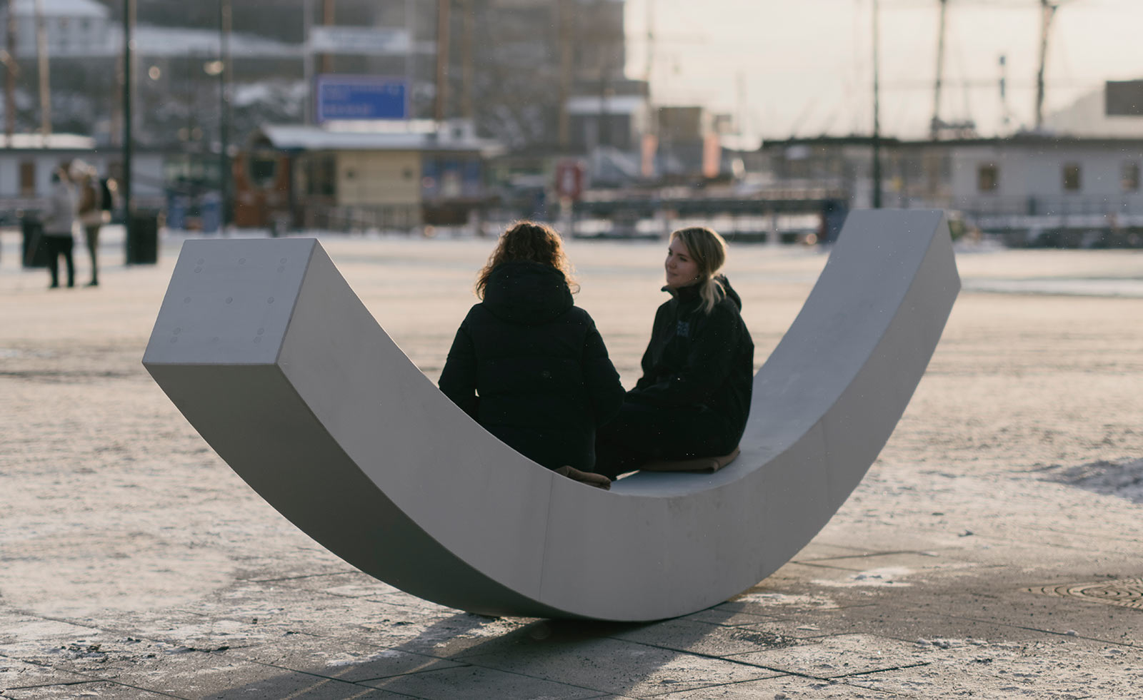 two people sitting on the peace bench in Oslo