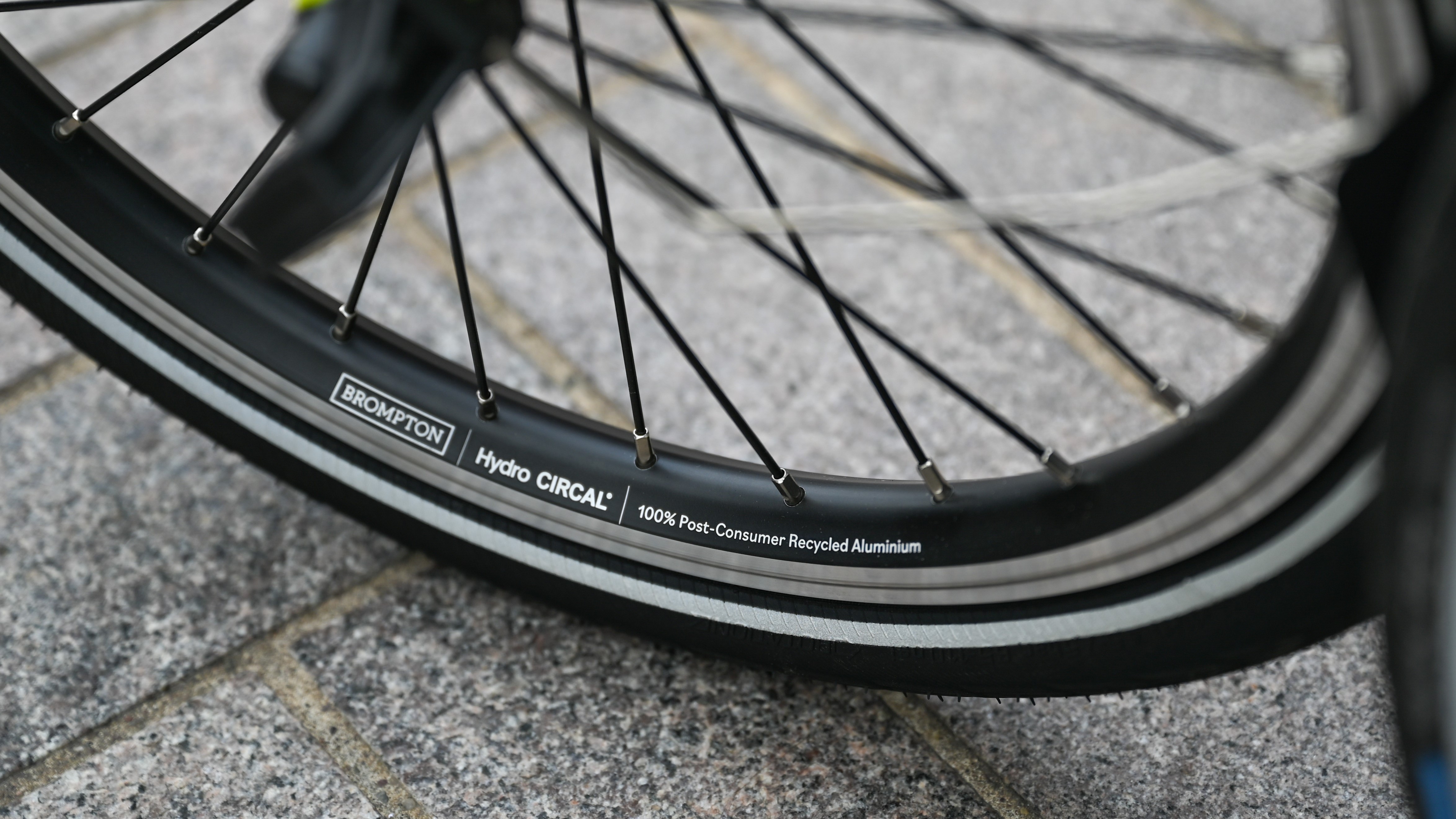 a bicycle tire on a sidewalk