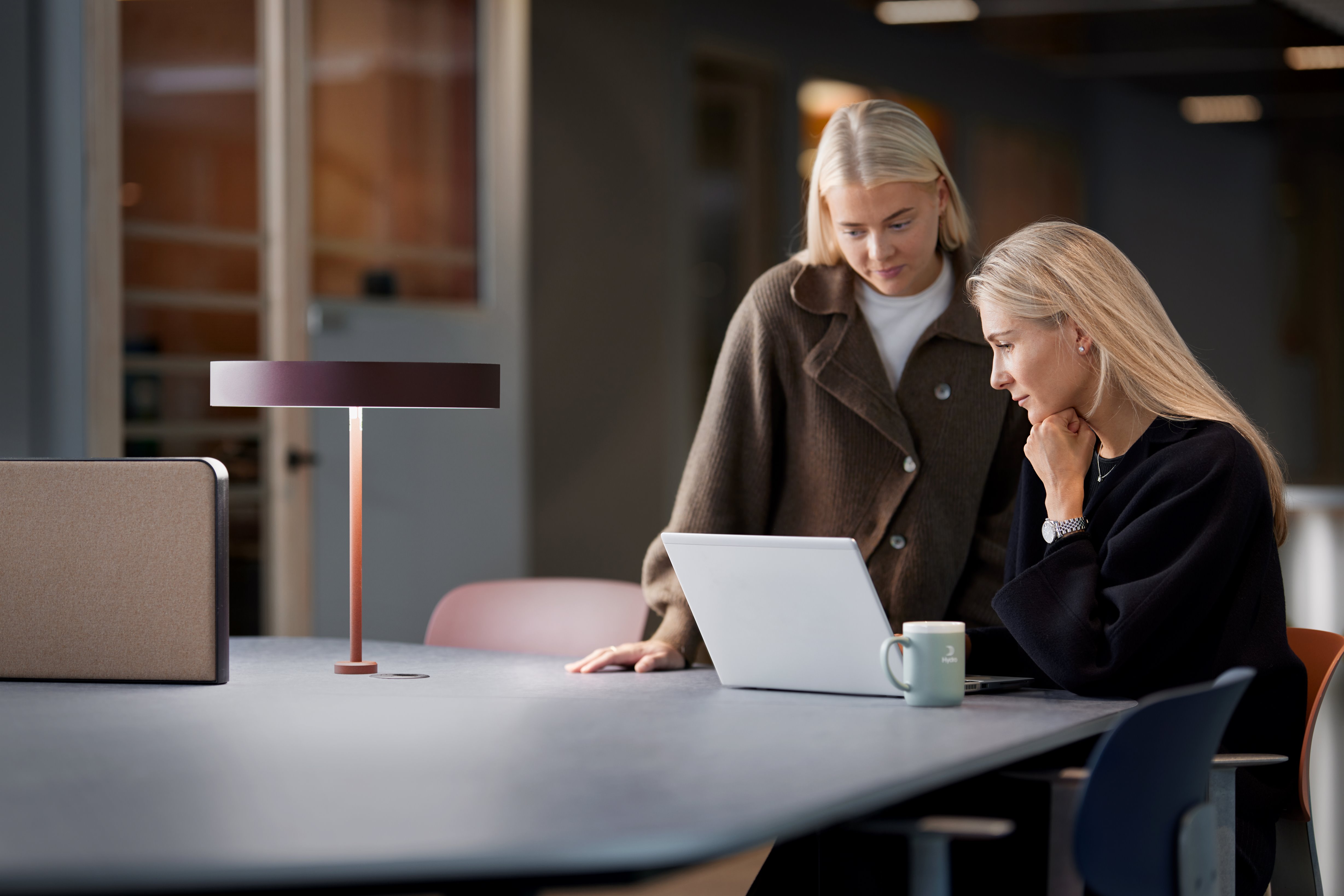 a few women sitting at a table