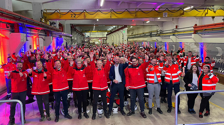 a group of people in red jackets