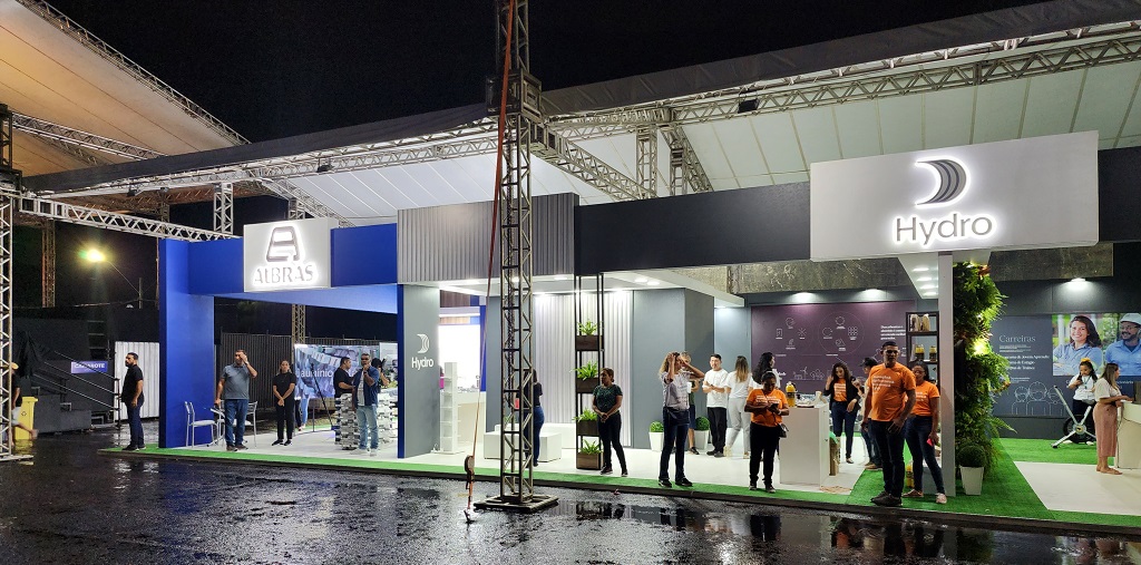 a group of people standing in front of a stage